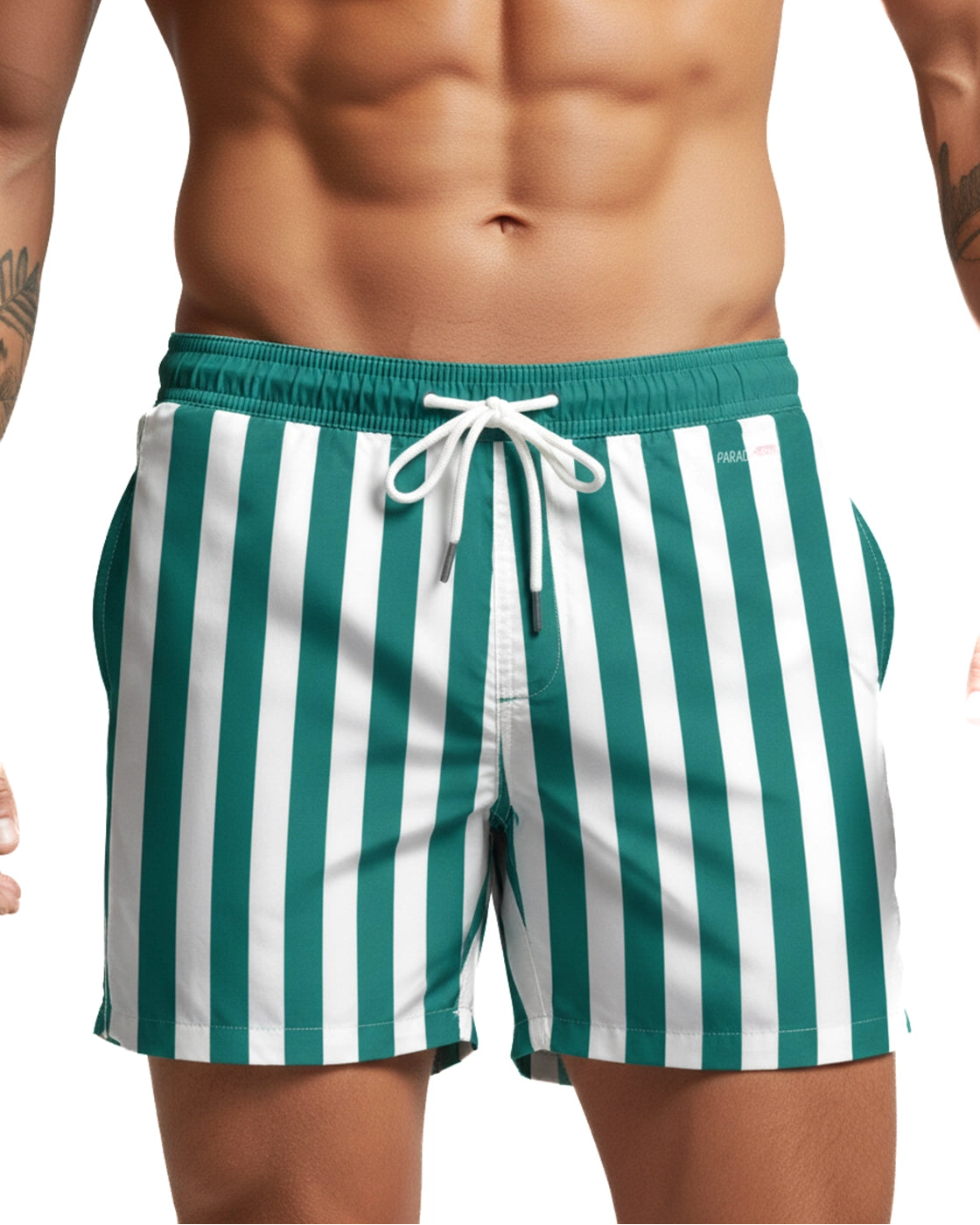 Green and white striped swim shorts worn by a person on a plain background