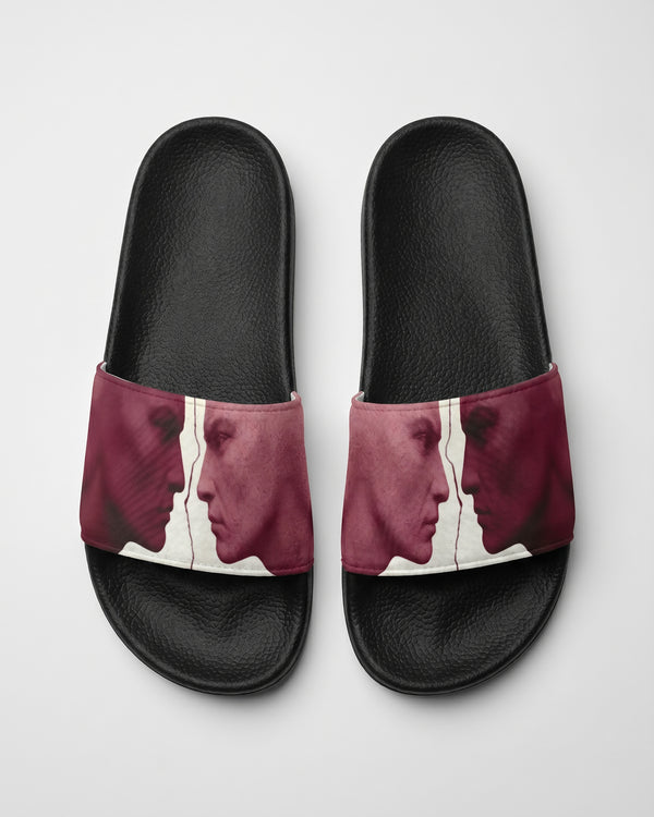 Burgundy and white Pair of slides with artistic design of two statue faces on a white background
