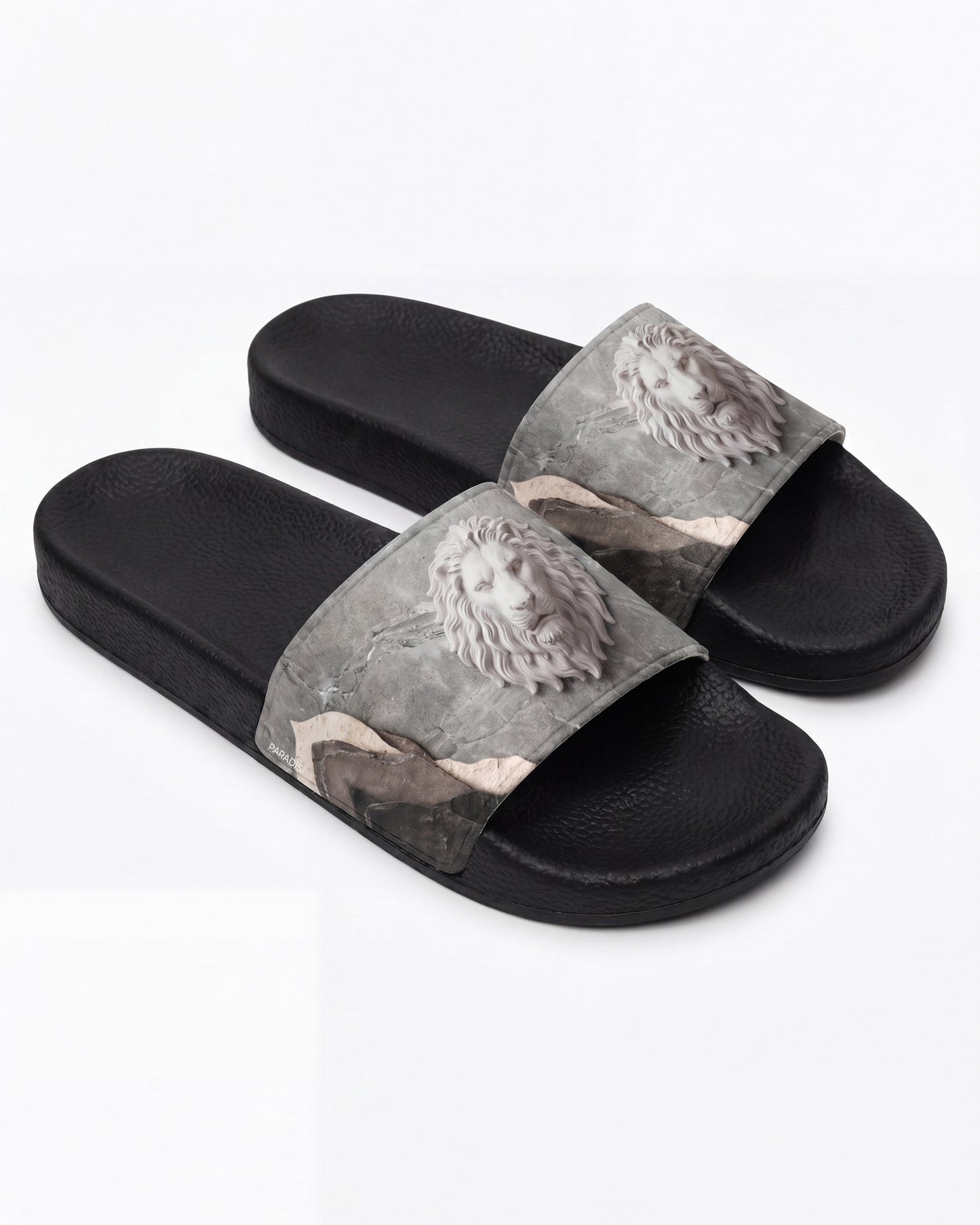 A grey and black Pair of slides with a pattern of a lion on a white background
