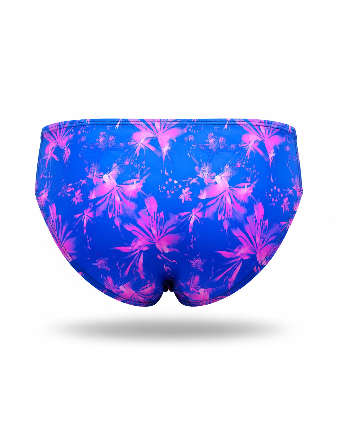 Back view of speedo-style swim brief featuring a blue and pink floral pattern on a white background by PARADIS SVP